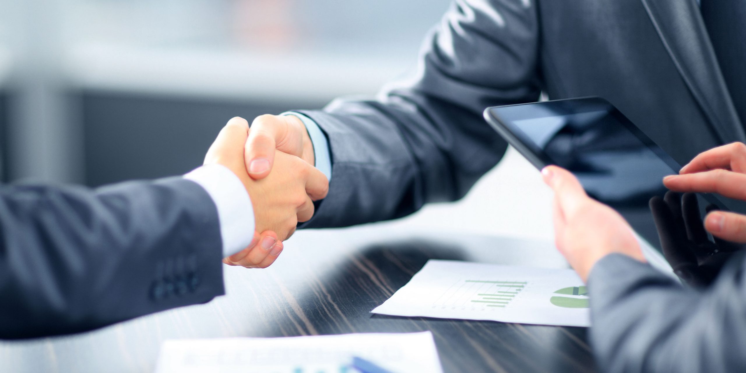 Business people shaking hands in office